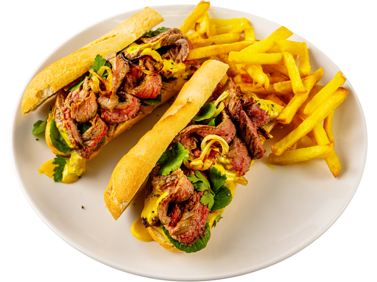 Two Irish Beef Minute Steak sandwiches with fries on a white plate.