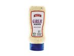 Garlic sauce bottle with a label stating 'Rich & Punchy' and nutritional information.