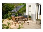 Wooden patio dining set with grey cushions and a large grey parasol on a tiled patio.