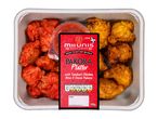 Pakora platter with tandoori chicken bites and onion pakora, with a red sauce.
