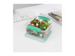 Sistema food container with fresh salad on a desk.