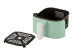 Mint green air fryer with a black removable cooking rack.